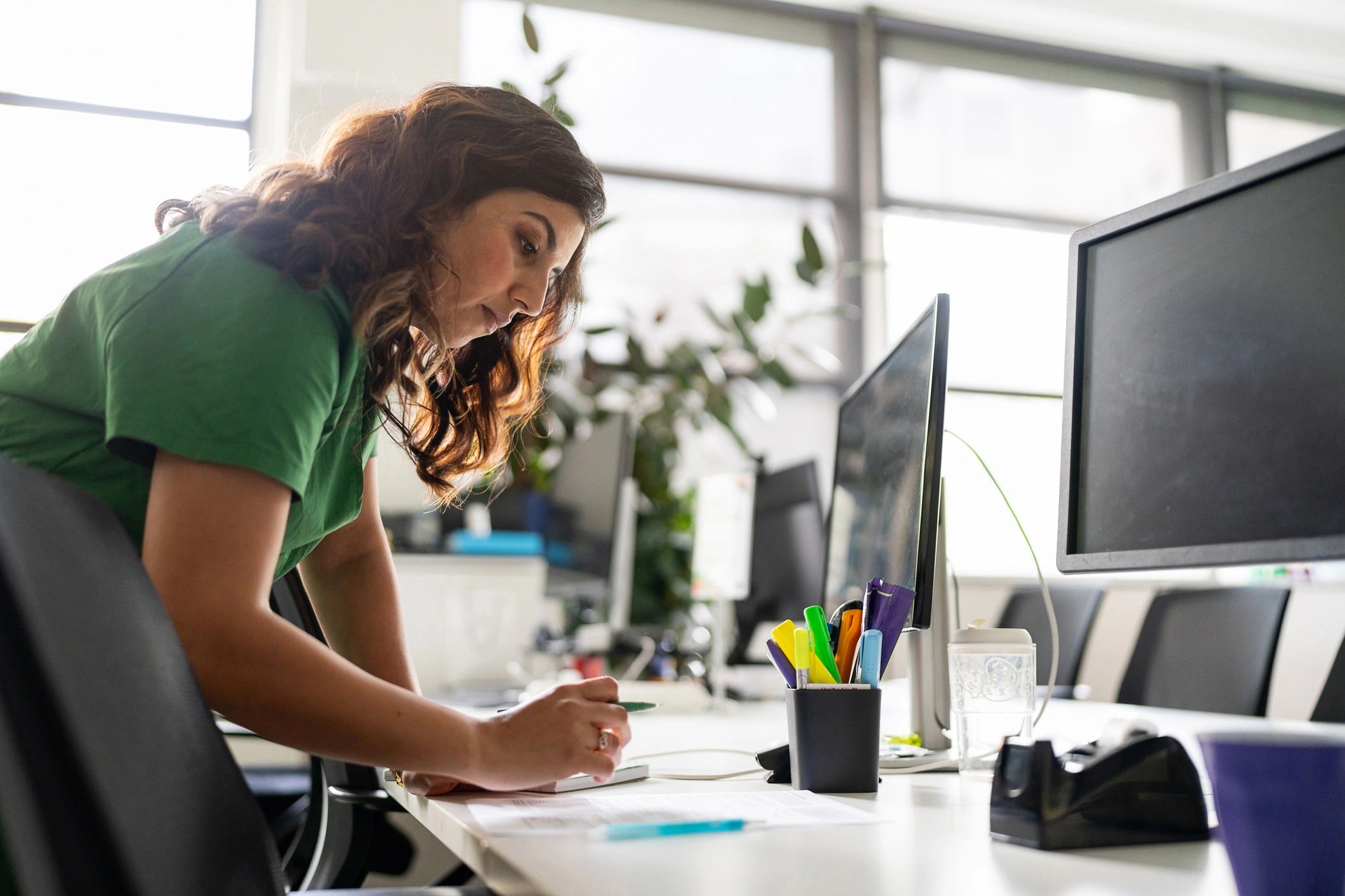 Creative professional working thoughtfully at a desk